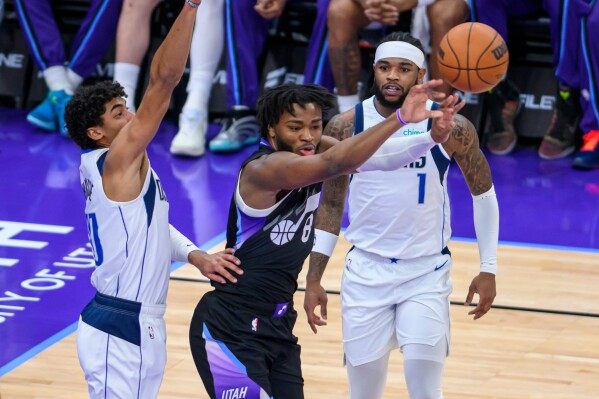 Jazz survive Flagg's 42 in OT win image