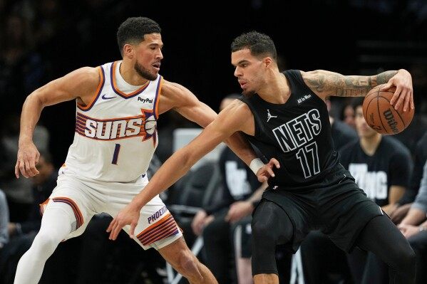 Brooks and Booker power Suns to a 126-117 win over the struggling Nets image