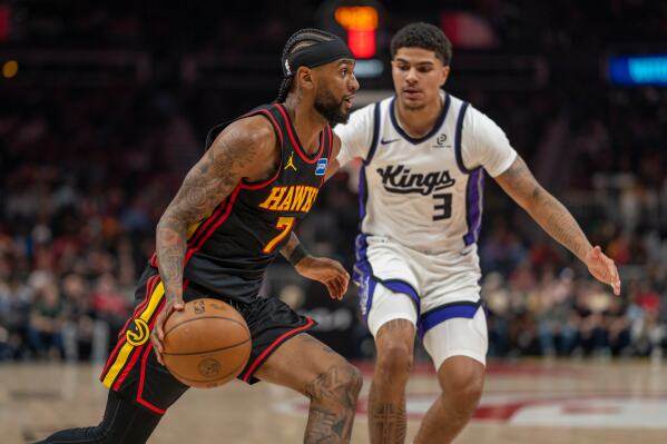 Hawks withstand fourth-quarter surge by Kings in 123-113 victory as Snyder gets 500th win image