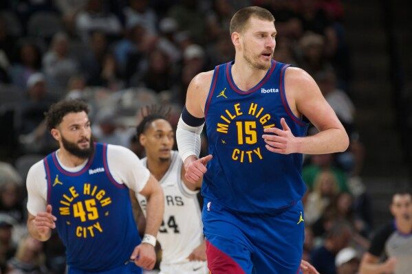 Nuggets center Nikola Jokic surges into playoffs after a scary knee injury and historic season image