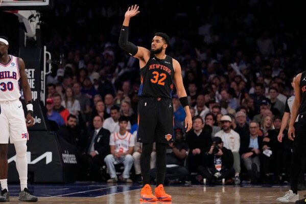 Glass cleaner: Karl-Anthony Towns dislodges ball behind backboard after Andre Drummond can’t image