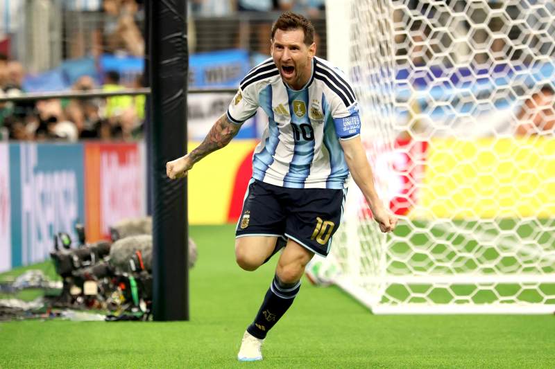 Messi enters record books as Argentina reach knockouts image
